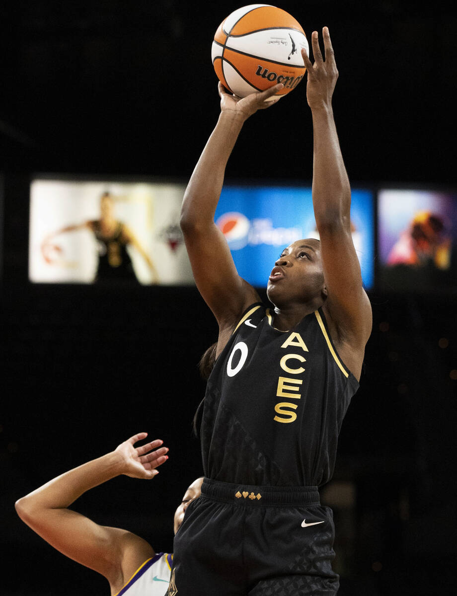 Aces guard Jackie Young (0) shoots in the first half during a WNBA basketball game against the ...