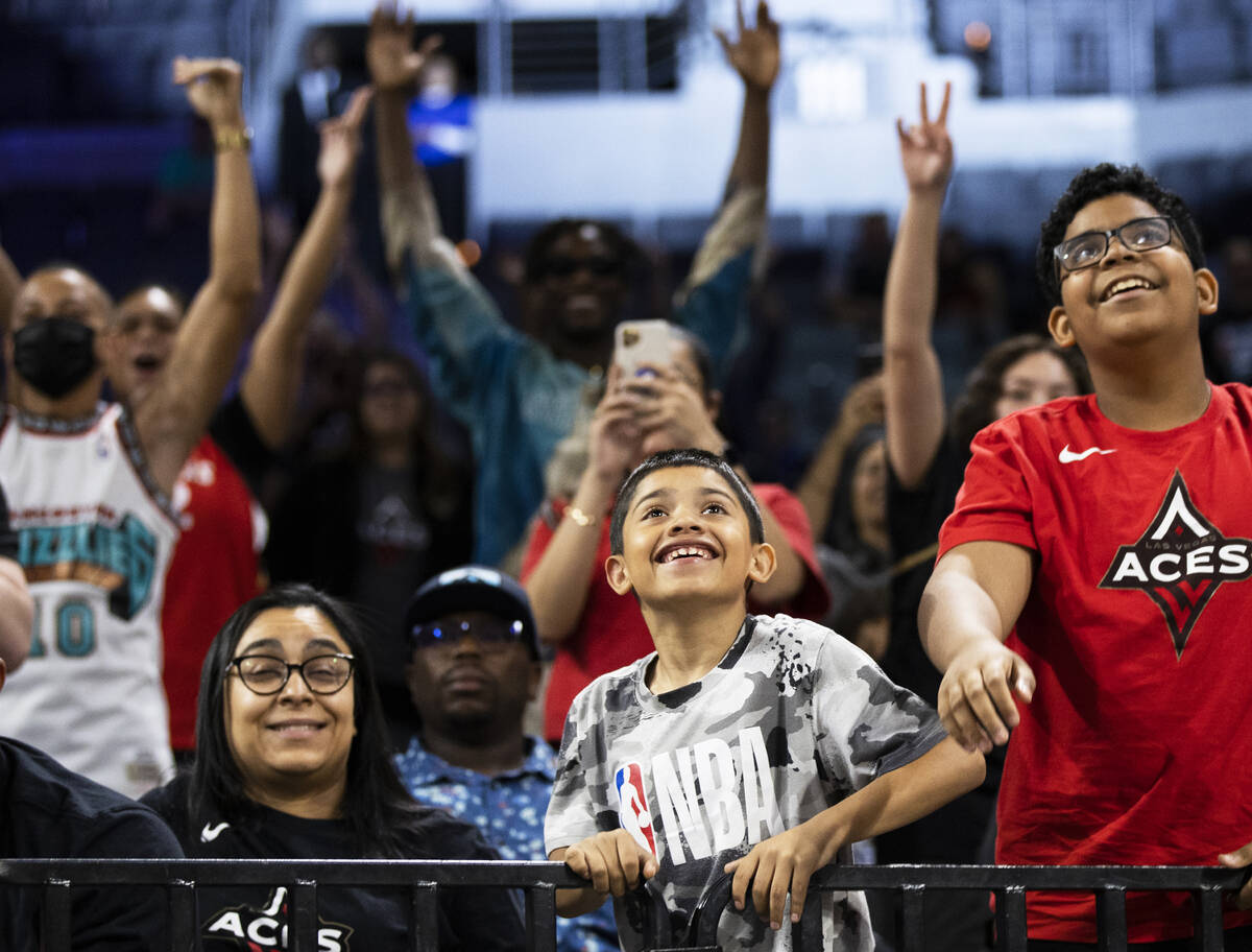 Fans cheer for the Aces during a WNBA basketball game against the Los Angeles Sparks on Monday, ...