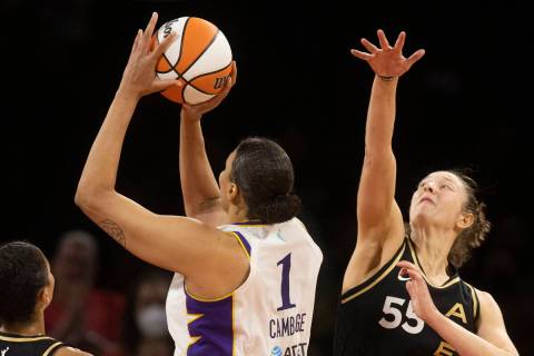 Aces forward Theresa Plaisance (55) extends to try and block the shot of Los Angeles Sparks cen ...