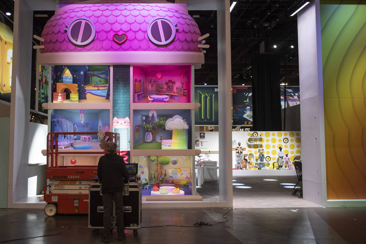 People prepare for the opening of the Licensing Expo at the Mandalay Bay Convention Center on M ...