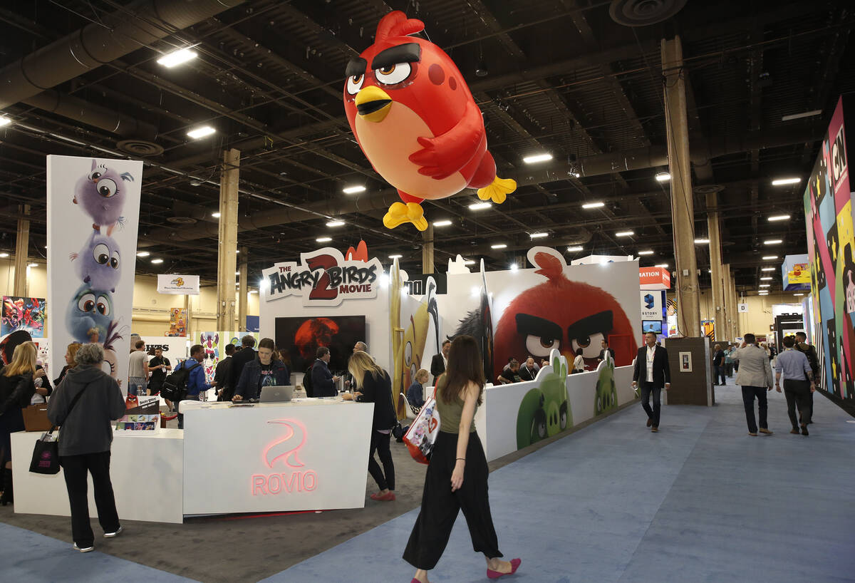 Visitors walk past the Angry Birds booth at the Licensing Expo in May 2018 in Las Vegas. (Bizua ...