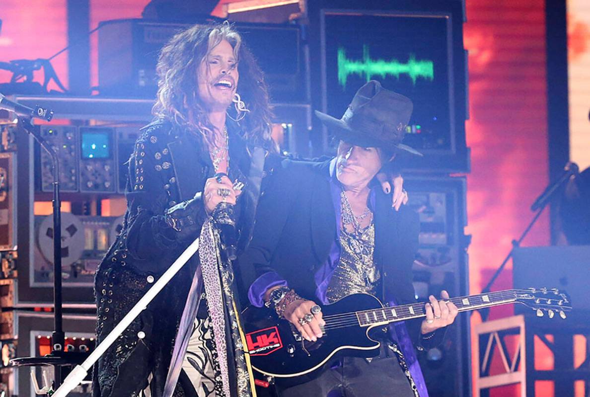 Steven Tyler, left, and Joe Perry of Aerosmith perform at the 62nd annual Grammy Awards, Jan. 2 ...