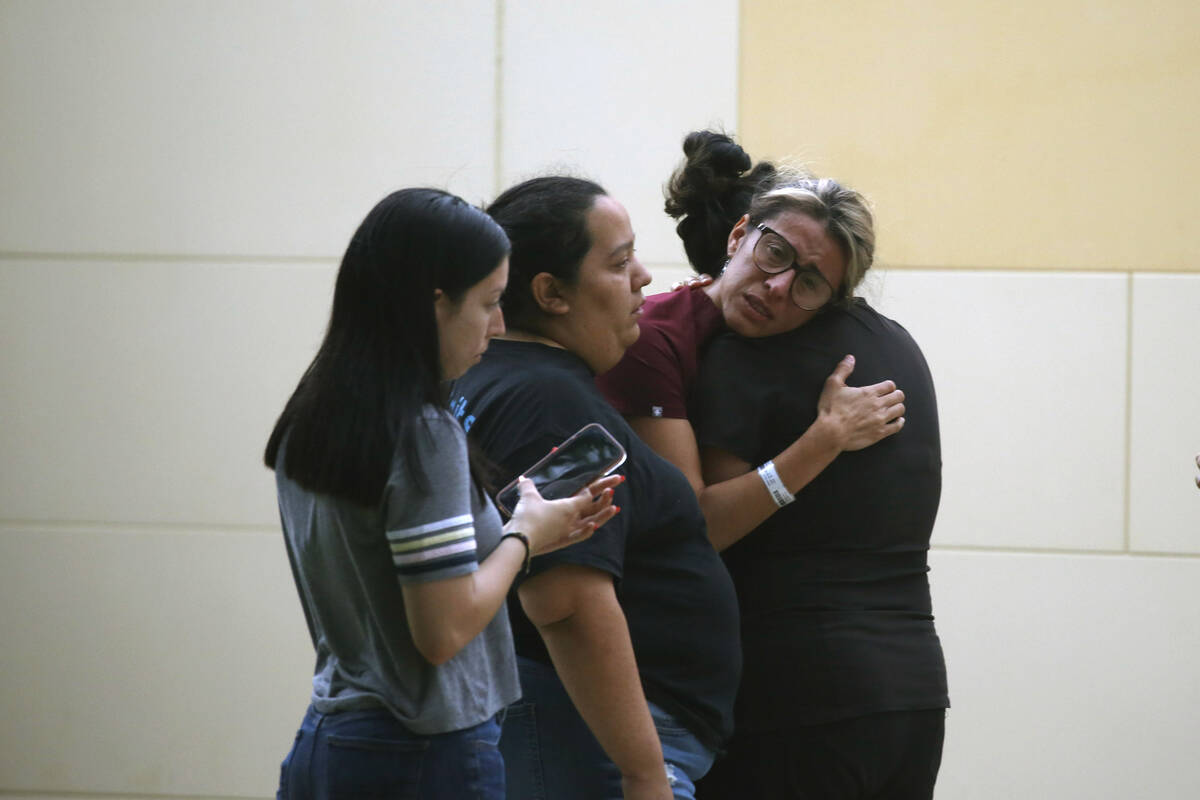 People react outside the Civic Center following a deadly school shooting at Robb Elementary Sch ...