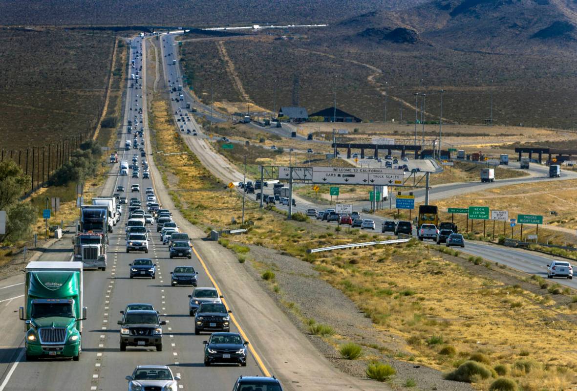 Holiday weekend traffic gets heavier at the state line as vehicles move northbound on Interstat ...