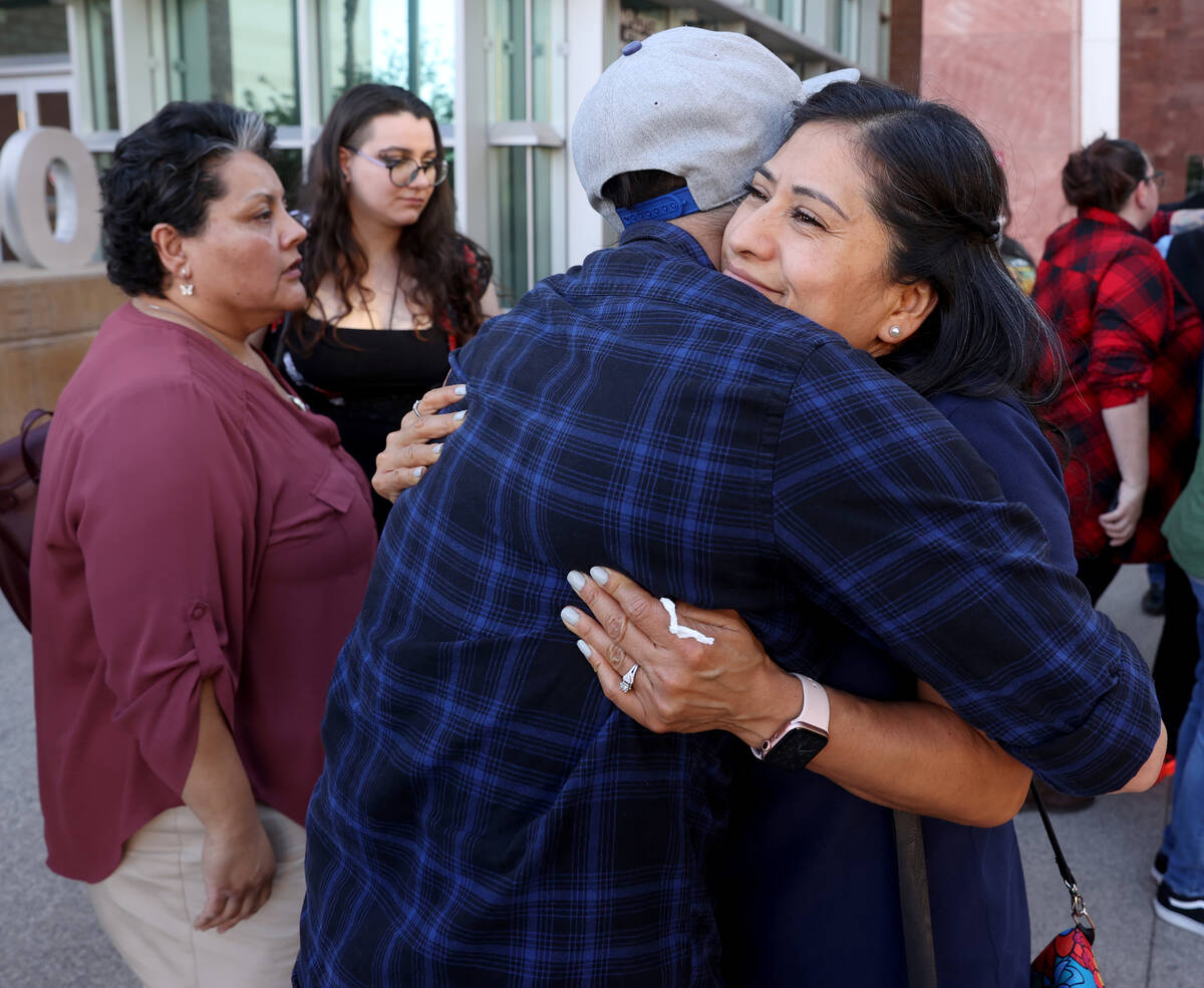 Maribel Arenas, aunt of Marcos Arenas, hugs Omar Arenas, brother of Marcos, after a guilty verd ...