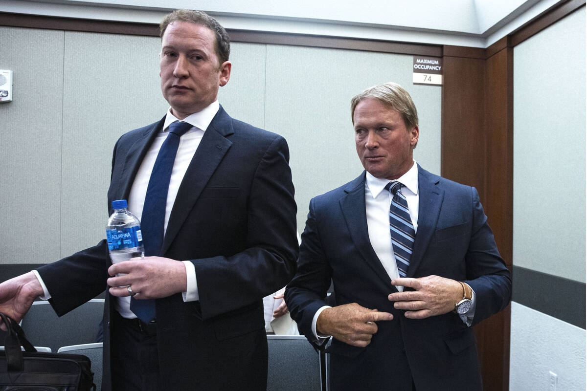 Former Raiders coach Jon Gruden, right, and his attorney Adam Hosmer-Henner appear in court at ...