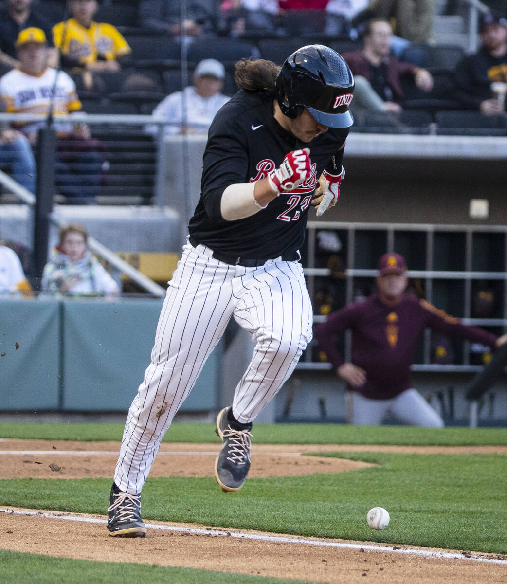 UNLV infielder Henry Zeisler (23) runs the base while watching the foul ball during the second ...