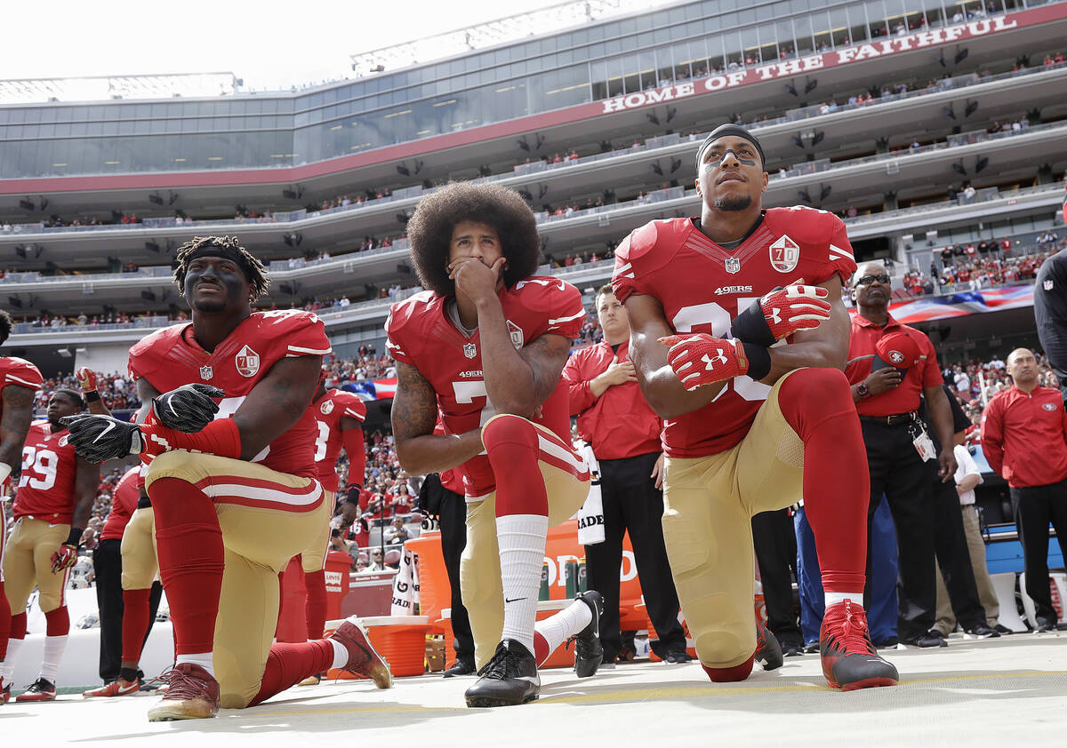 In this Oct. 2, 2016, file photo, from left, San Francisco 49ers outside linebacker Eli Harold, ...