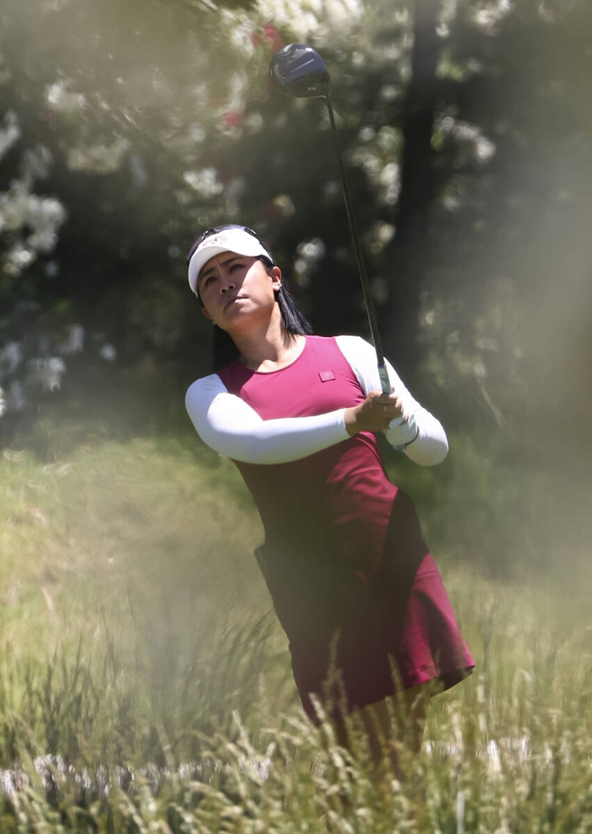 Danielle Kang tees off at the 12th hole while playing against Kelly Tan, not pictured, in the f ...
