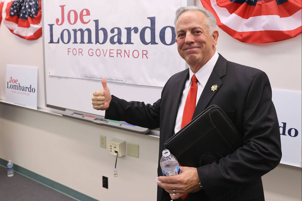 Clark County Sheriff Joe Lombardo poses with his campaign sign after announcing his candidacy for...