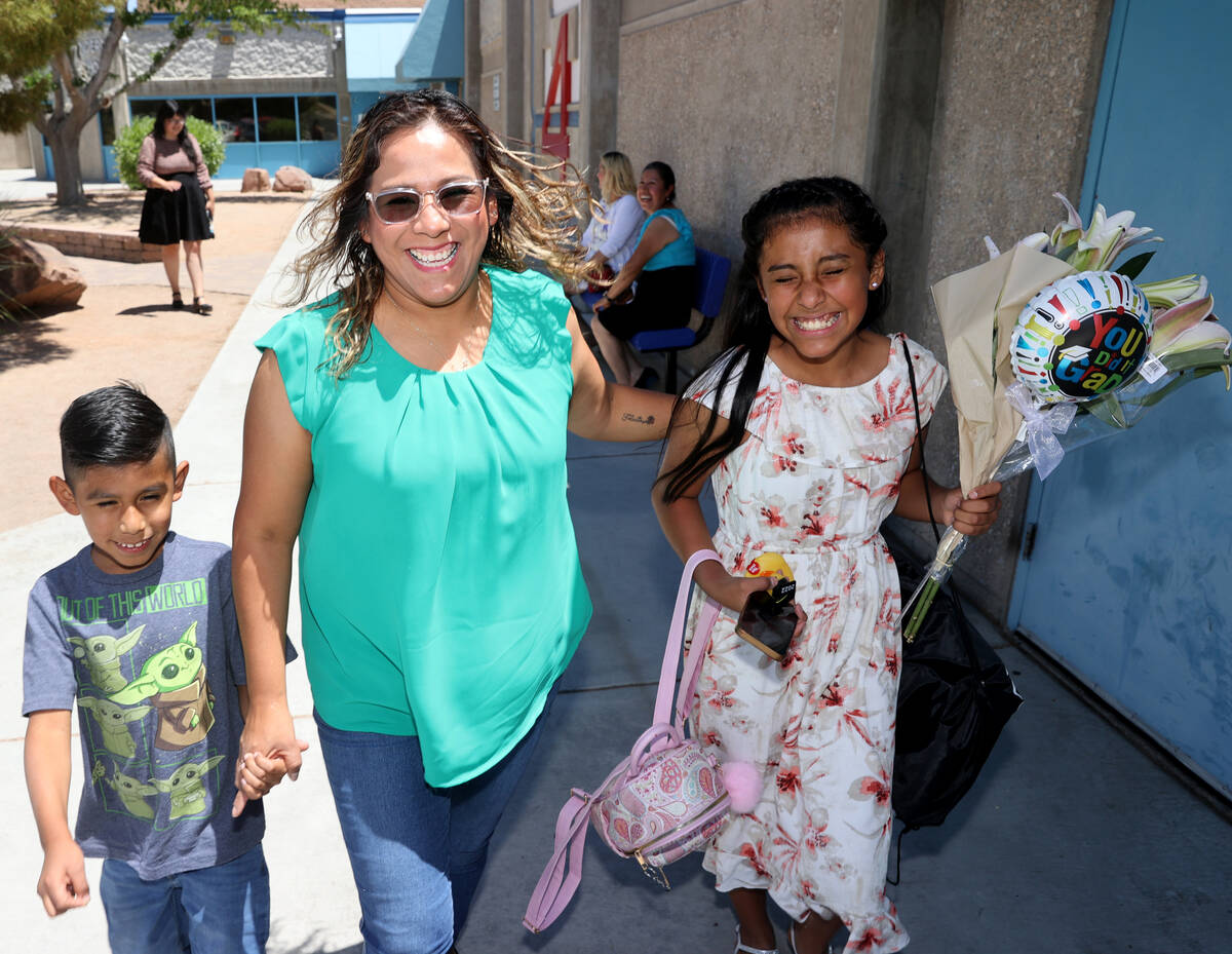 Fifth grade graduate Grace Cordova with her mother, Areli, and 8-year-old brother, Alexander, o ...