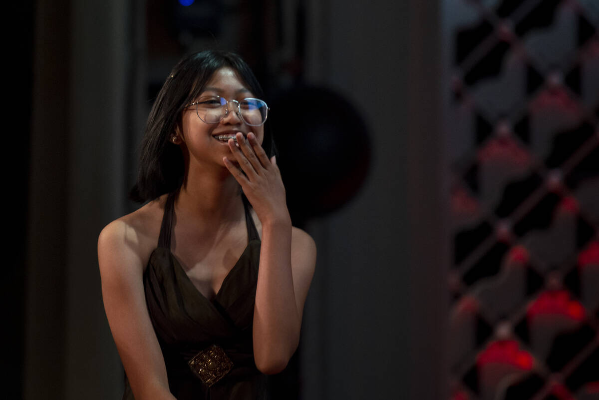 Green Valley High School's Mischa Abad, a ninth grader, gets up to accept her award at the Revi ...