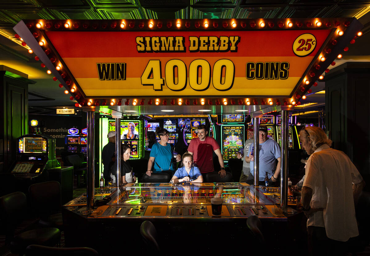 People play the coin-operated Sigma Derby game at the D Las Vegas on Tuesday, May 24, 2022, in ...