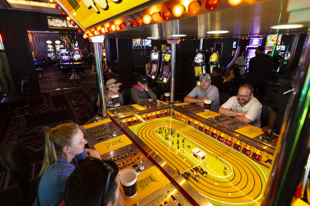 People play the coin-operated Sigma Derby game at the D Las Vegas on Tuesday, May 24, 2022, in ...