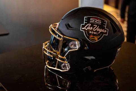 A football helmet is pictured with the Las Vegas Bowl logo on Monday, Dec. 27, 2021. (Chase Ste ...