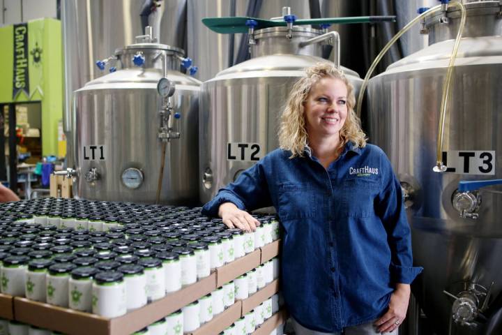 Owner of CraftHaus Brewery Wyndee Forrest stands near their in house craft beer in cans which h ...