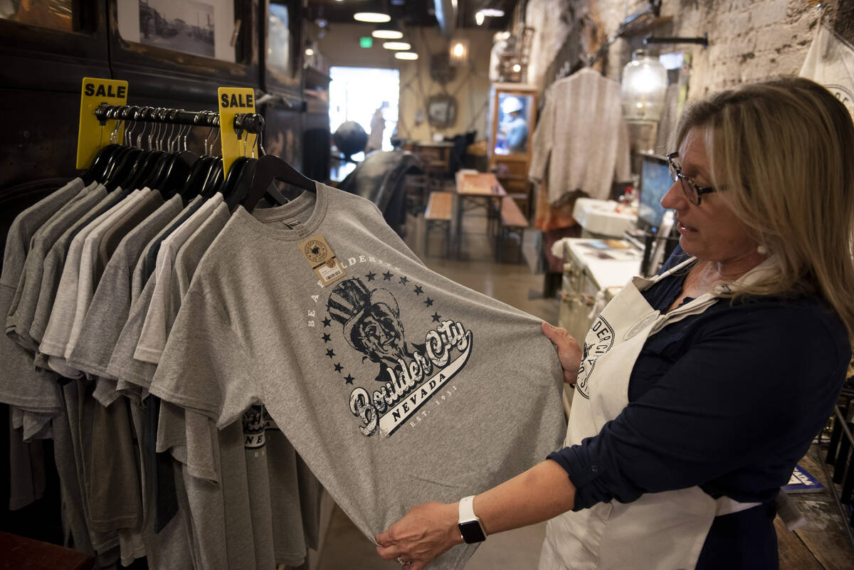 Boulder City Co. Store owner Tara Bertoli shows off some of her shirts on Thursday, May 26, 202 ...