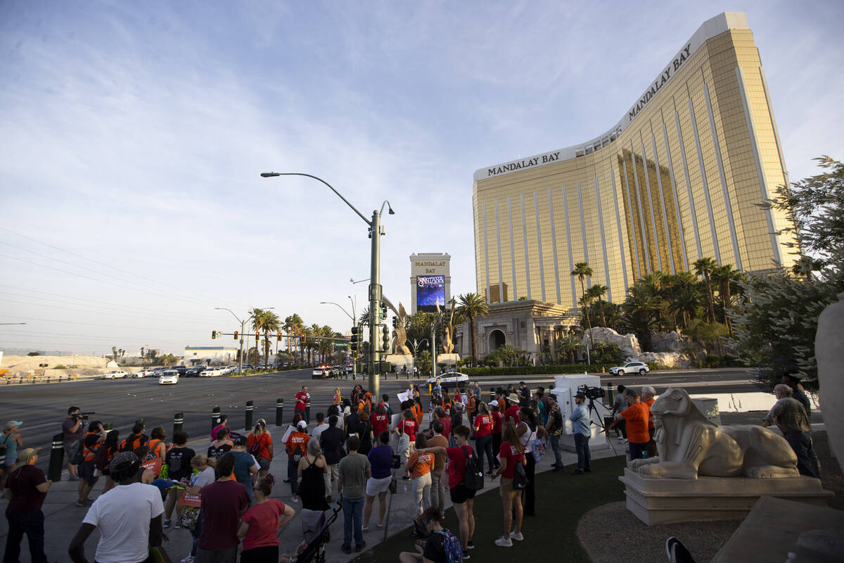 People participate during a rally and march by Moms Demand Action and Clark County School Distr ...