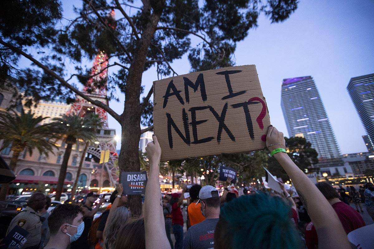 People participate during a rally and march by Moms Demand Action and Clark County School Distr ...