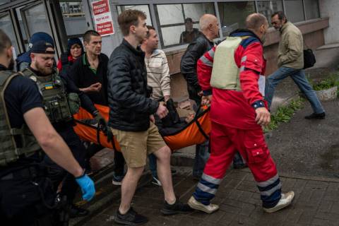 An injured man as a result of shelling is carried on a stretcher in Kharkiv, eastern Ukraine, T ...
