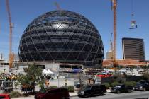 The final beam lifted to be placed at the top of the MSG Sphere at The Venetian during a toppin ...