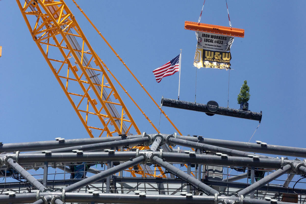 The final beam is placed at the top of the MSG Sphere at The Venetian during a topping-out cere ...