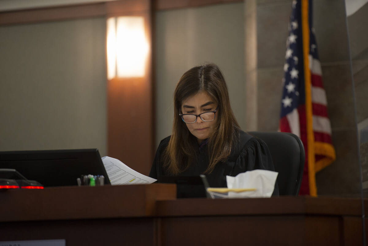 District Judge Bita Yeager looks over paperwork during a competency hearing for Jonathan Martin ...