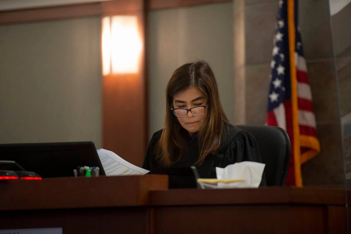 District Judge Bita Yeager looks over paperwork during a competency hearing for Jonathan Martin ...