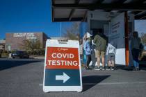 People wait and are served for COVID-19 testing at the Veterans Memorial Community Center on Tu ...