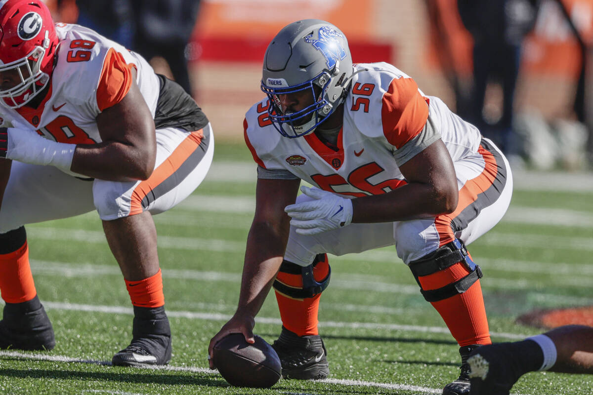 American Team offensive lineman Dylan Parham of Memphis (56) snaps the ball in an NCAA college ...