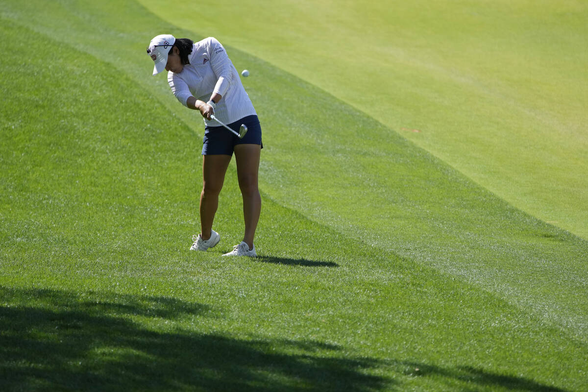 Danielle Kang hits from the rough on the first hole during the third day of round-robin play in ...