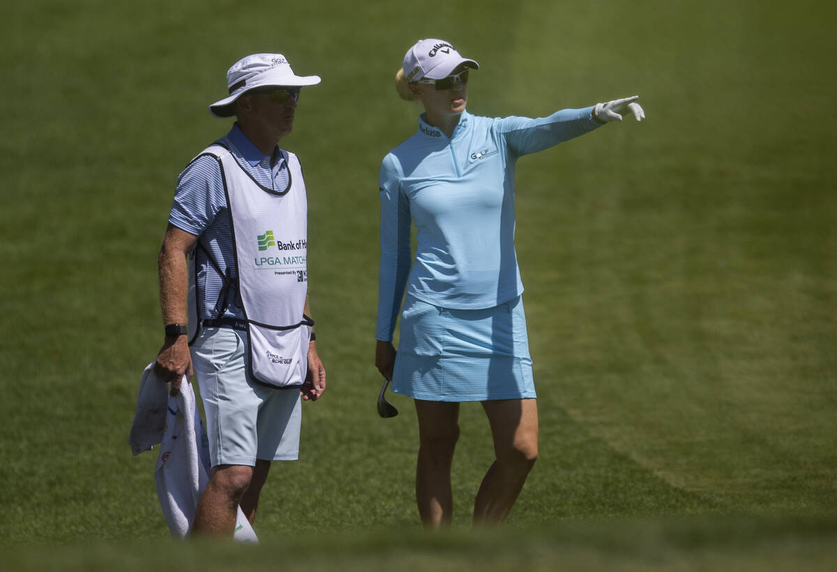 Madalene Sagstrom, right, talks with her caddy on the 6th hole during the fourth day of the LPG ...