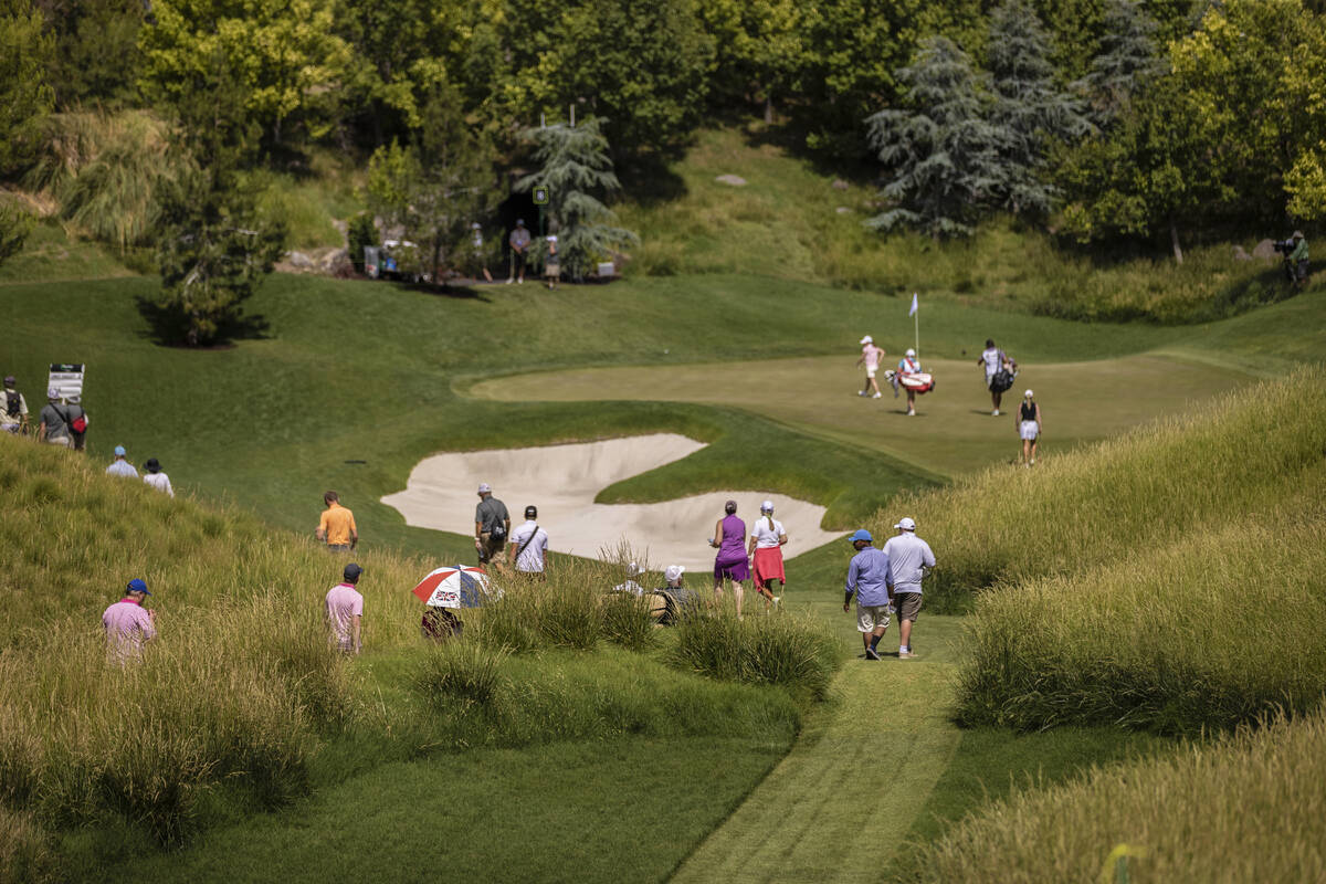 Attendees walk the 8th hole during the fourth day of the LPGA Bank of Hope Match Play golf tour ...