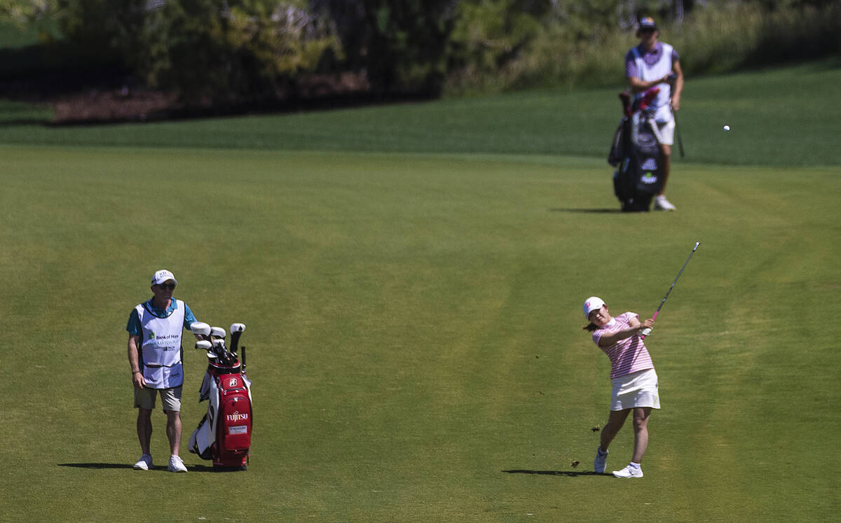Lilia Vu, right, hits off the fairway of the 6th hole during the fourth day of the LPGA Bank of ...