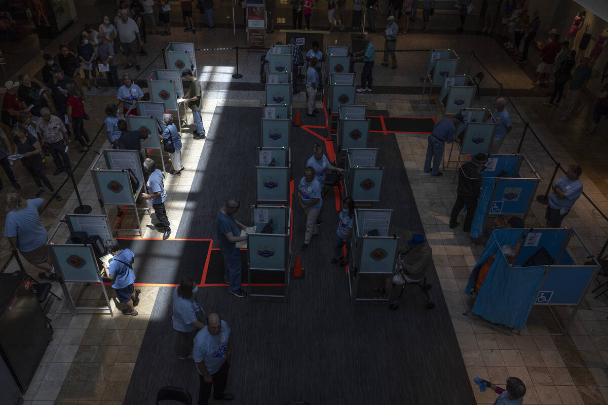Early voters cast their ballots at the polling site at Galleria at Sunset shopping mall on Satu ...