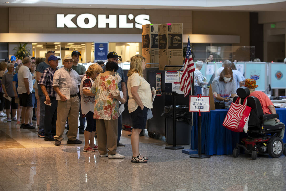 Early voters wait in line to cast their ballot at Galleria at Sunset shopping mall on Saturday, ...