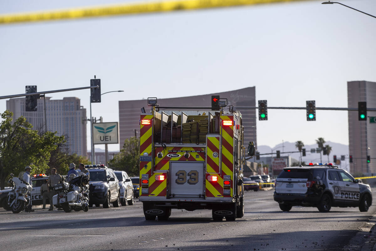 Metropolitan police and Las Vegas Fire investigate the scene where one person died after a vehi ...