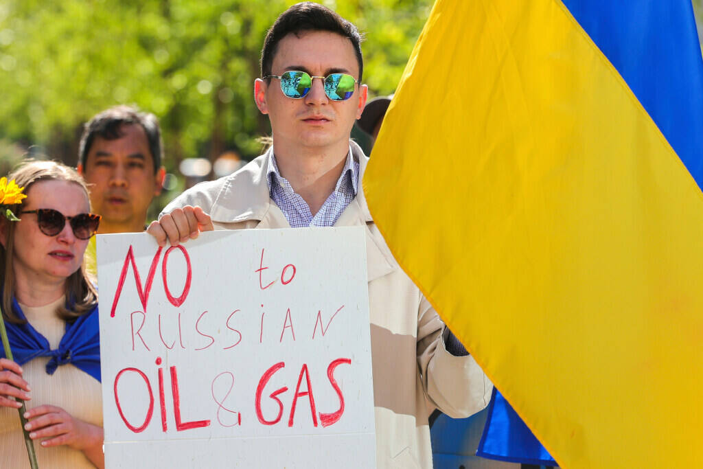 Ukrainian demonstrators demand an embargo on Russian oil during a protest in front of EU instit ...