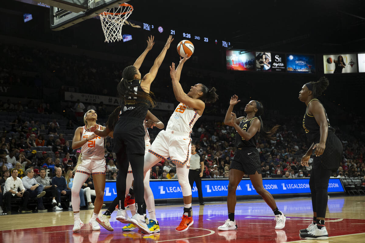 Connecticut Sun forward Alyssa Thomas (25) shoots against Las Vegas Aces center Kiah Stokes (41 ...