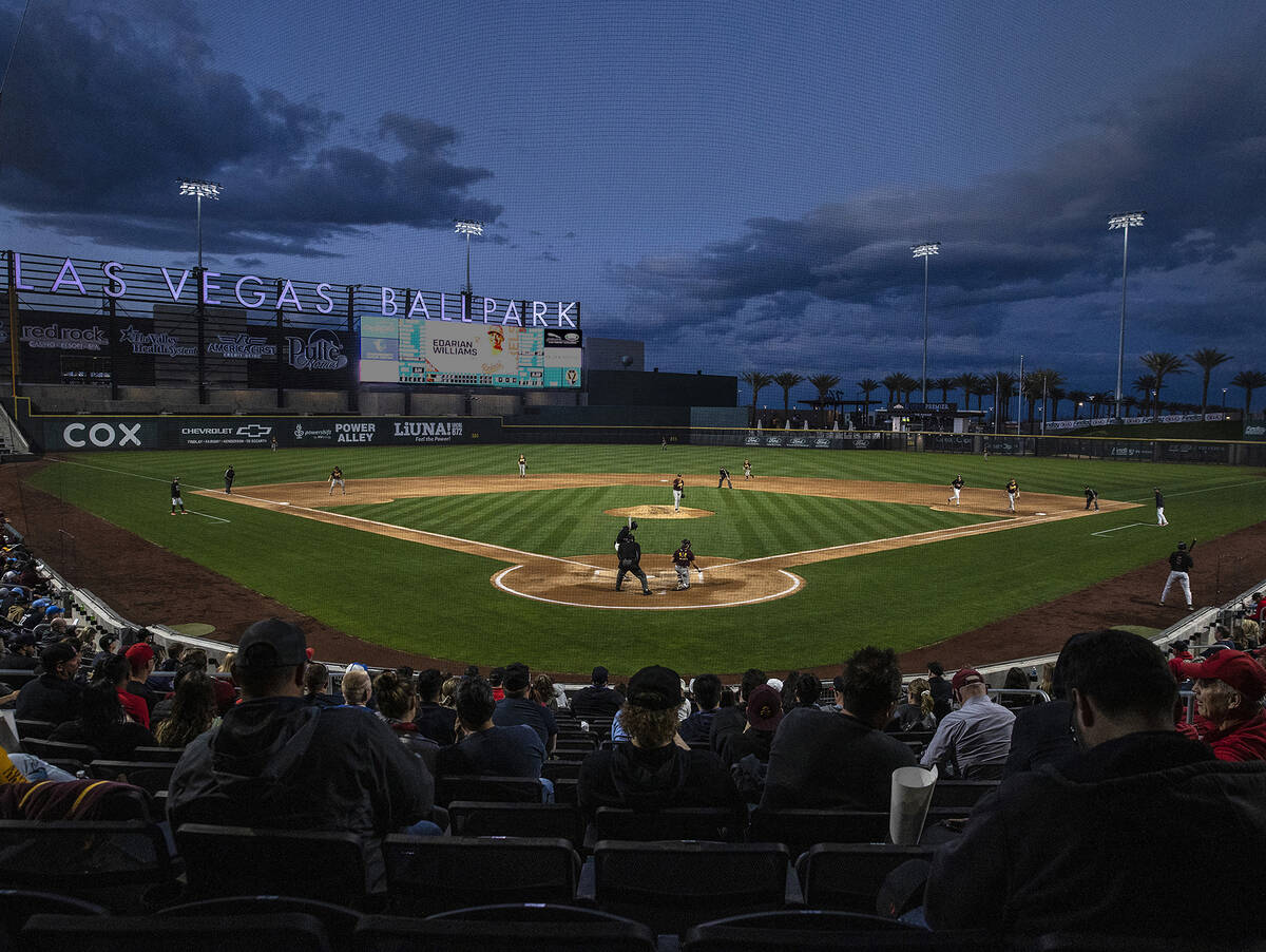 Fans watch an NCAA college baseball game between Arizona St. and UNLV at Las Vegas Ballpark on ...