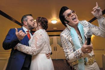 After 35 years together, Hugo and Sally Knight from Ireland kiss during their wedding ceremony ...