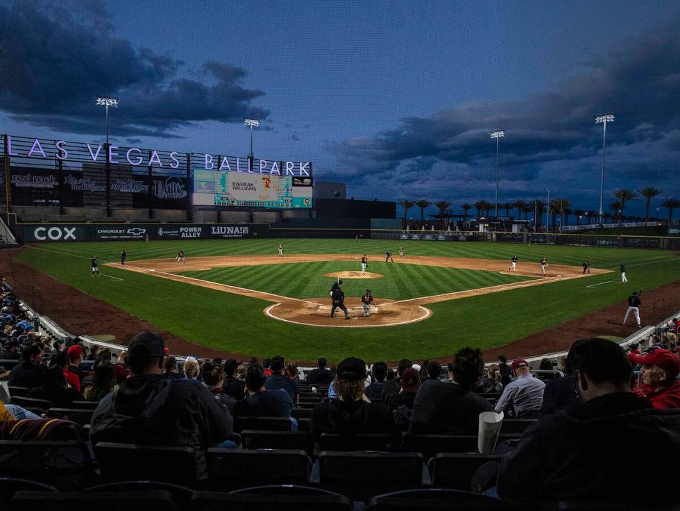 Fans watch an NCAA college baseball game between Arizona St. and UNLV at Las Vegas Ballpark on ...