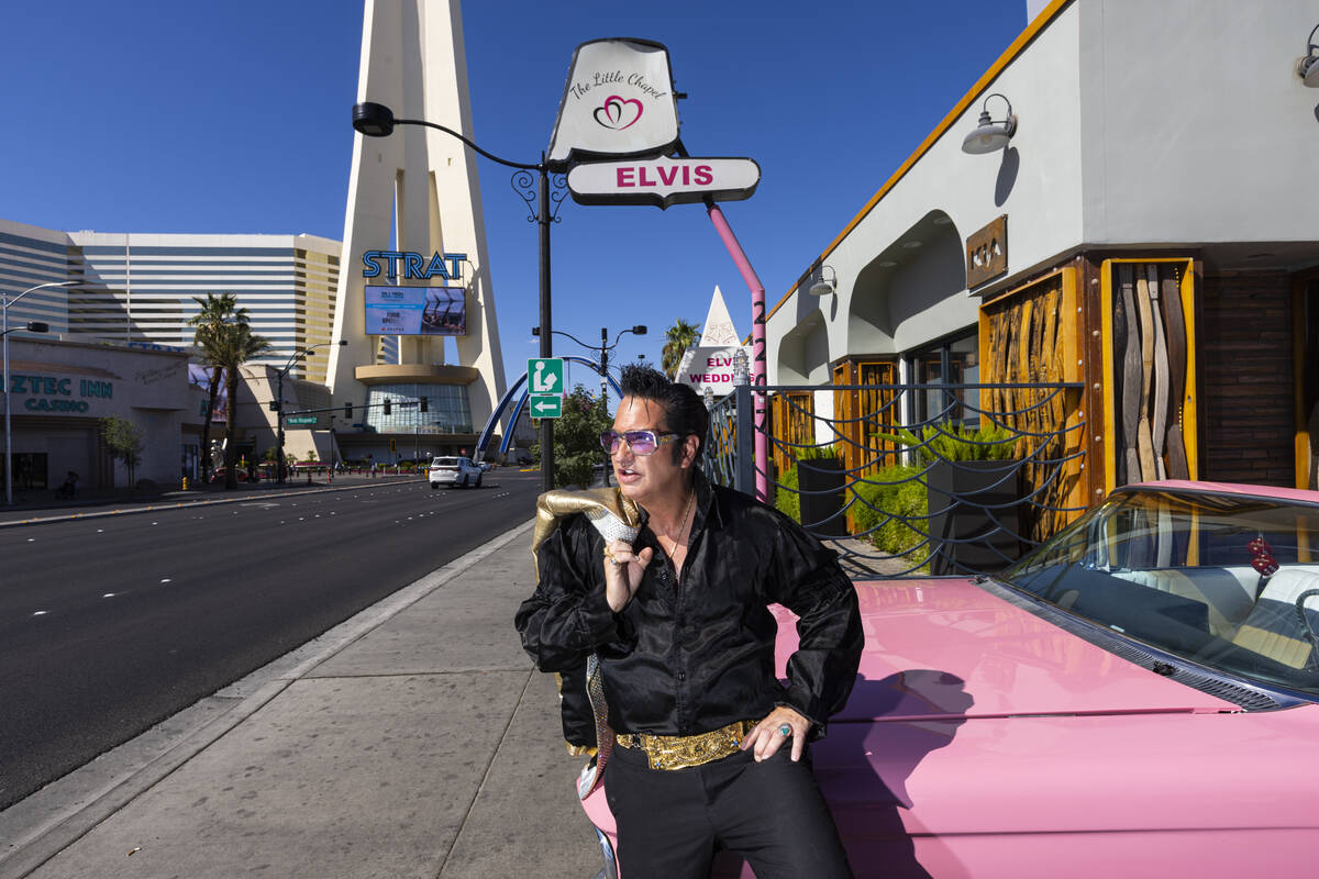 Elvis tribute artist Jesse Garon poses with his 1960 Cadillac outside of the Little Chapel of H ...