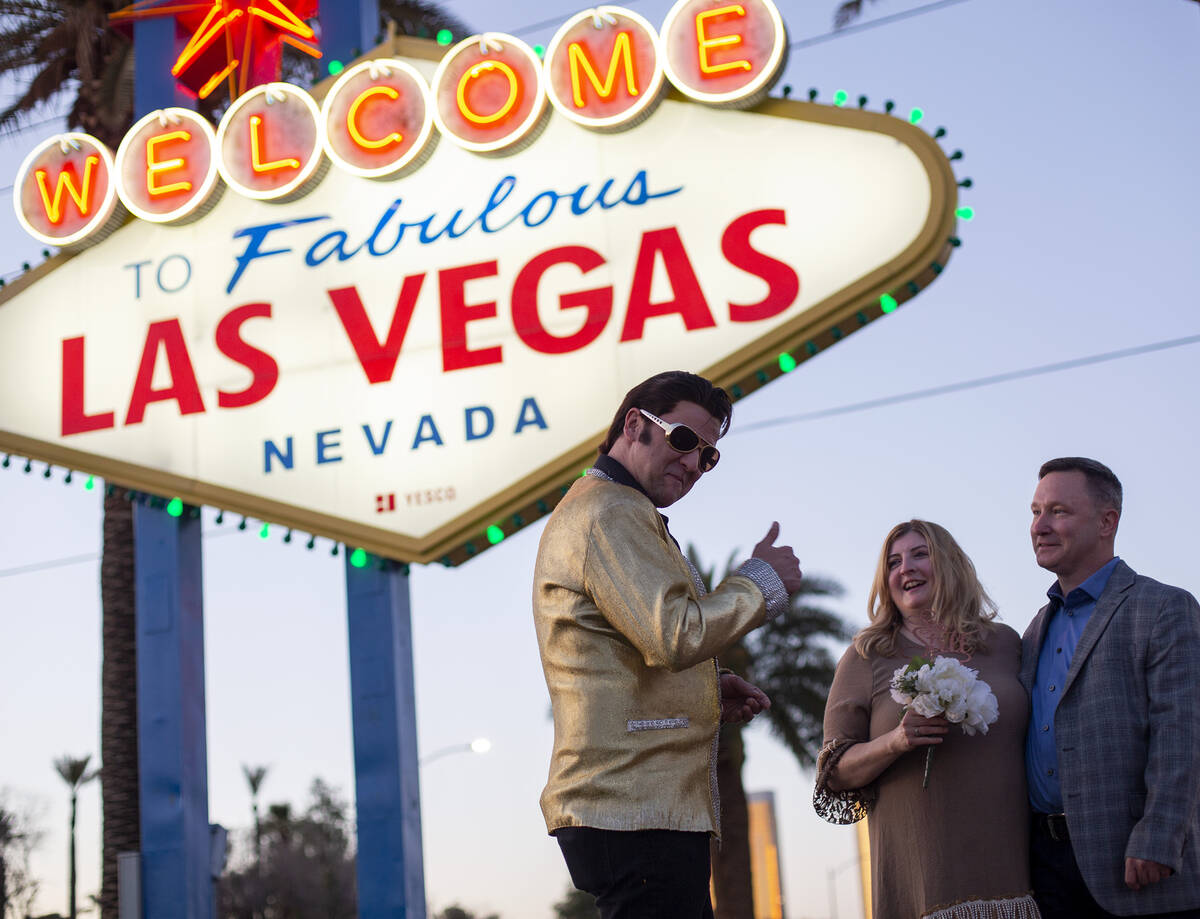 Amanda Anderson and Alan Anderson have their vows renewed by an Elvis impersonator at the Welco ...
