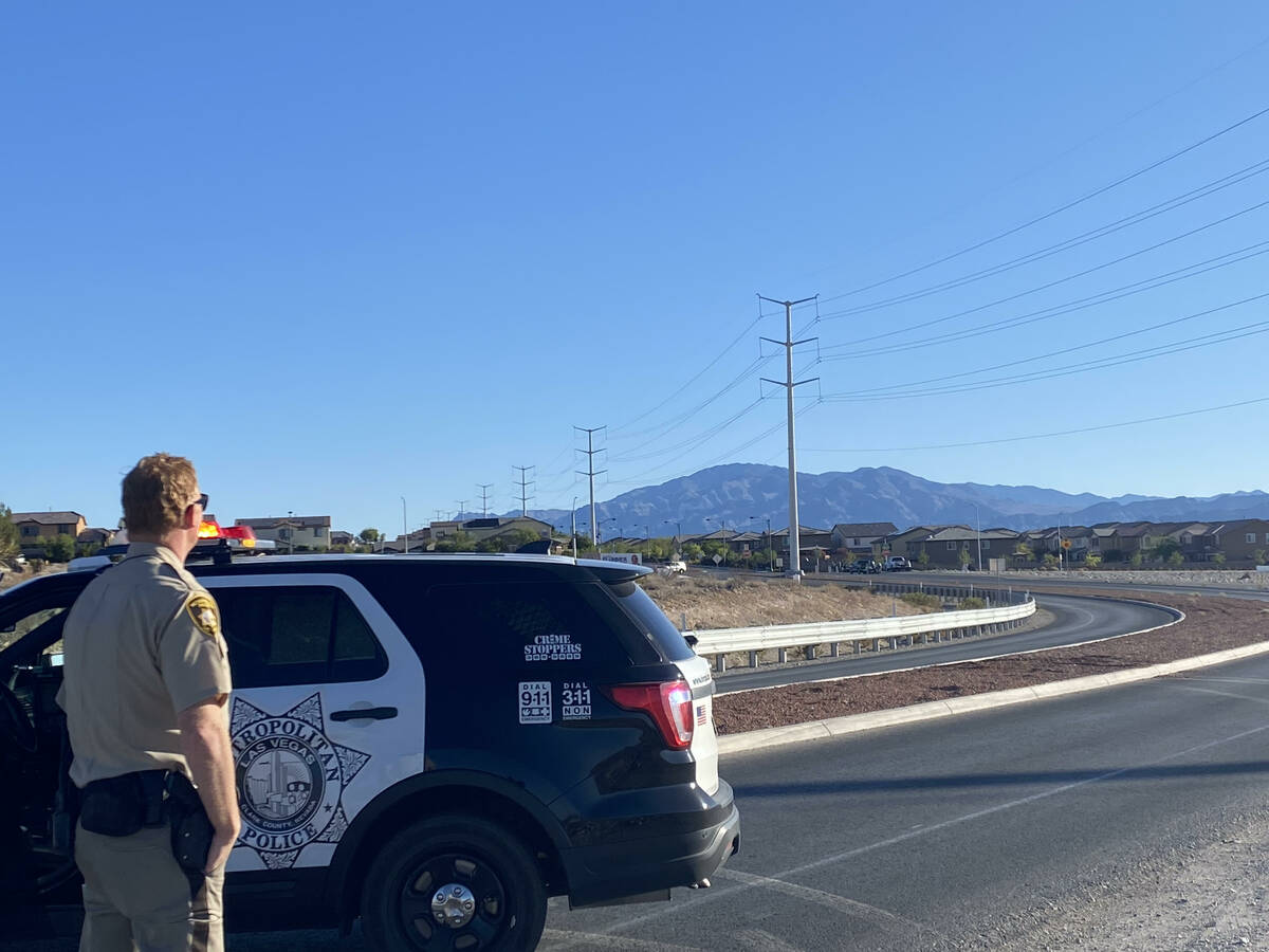 Las Vegas police investigate near the intersection of Centennial Parkway and Shaumber Road afte ...