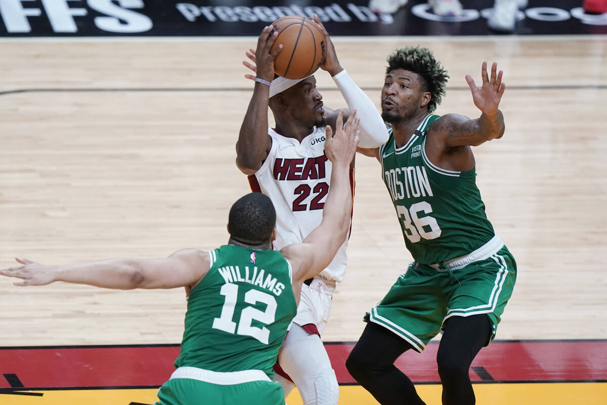 Boston Celtics guard Marcus Smart (36) and forward Grant Williams (12) guard Miami Heat forward ...