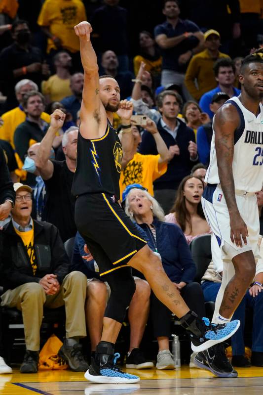 Golden State Warriors guard Stephen Curry after shooting a 3-point basket against the Dallas Ma ...