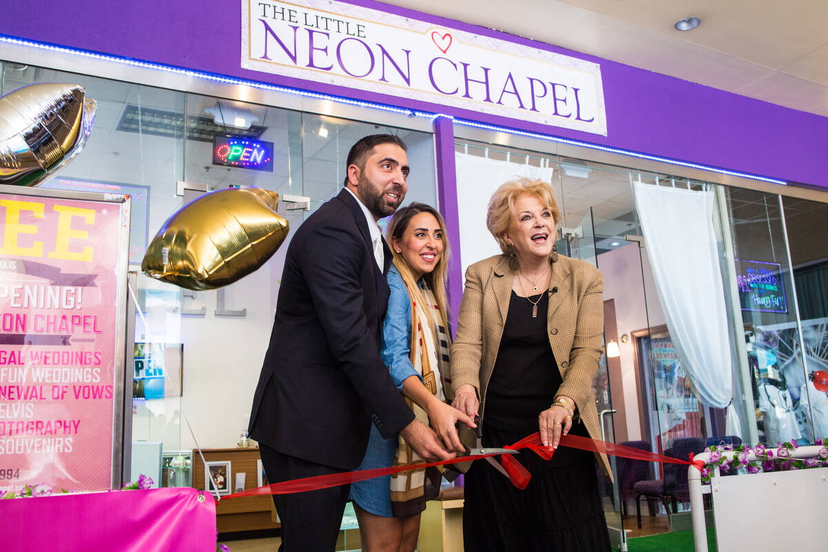 Little Neon Chapel owner Ben Silvano, left, Silvano's sister Sara El Hage, center and Mayor Car ...