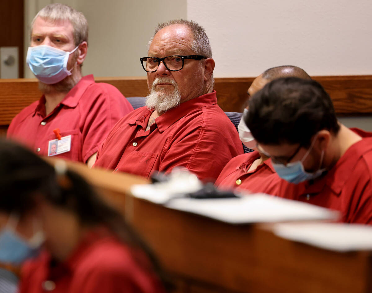 Richard Devries, 66, second from left, makes his initial court appearances in Henderson Justice ...