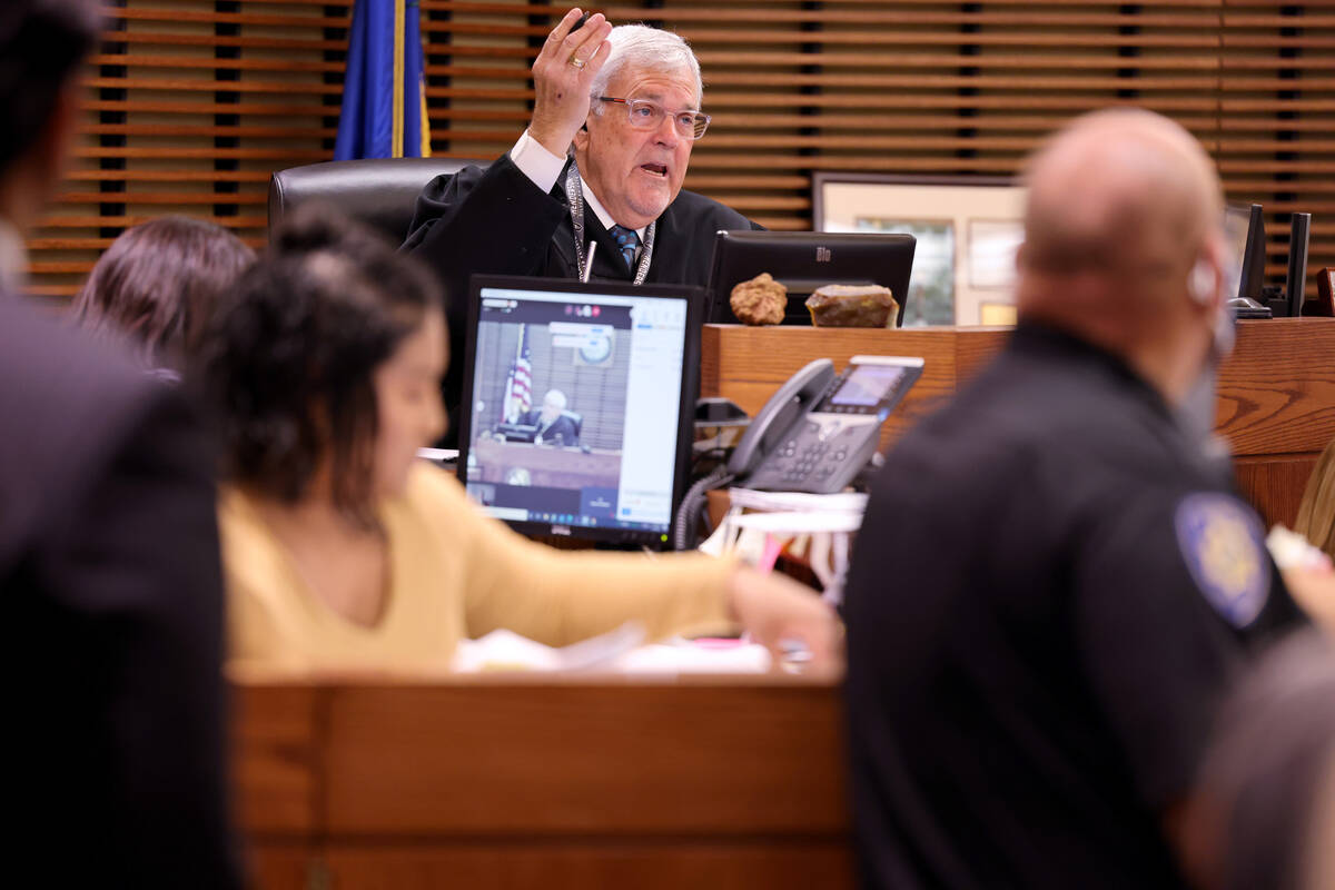 Justice of the Peace David Gibson presides during the initial court appearances of three Hells ...